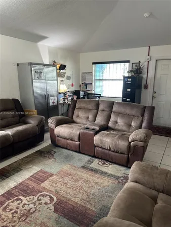 a living room with furniture and a couch