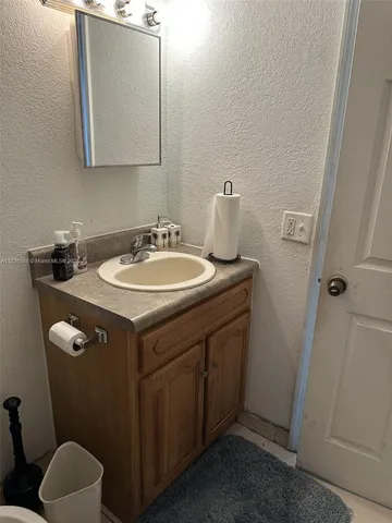 a bathroom with a sink and a toilet