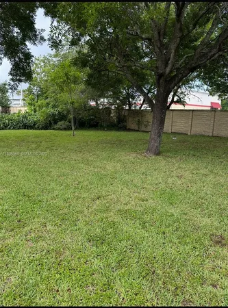 a view of backyard with green space