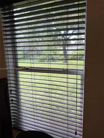 a view of a balcony next to a window