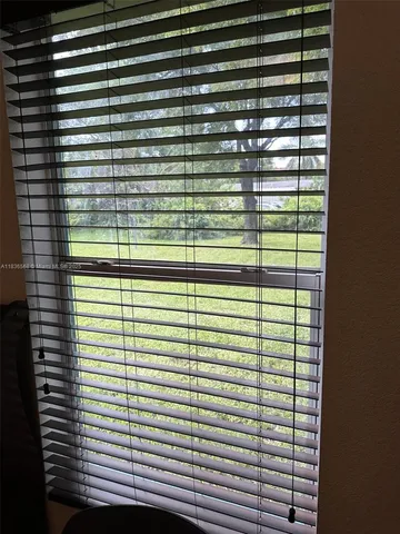 a view of a balcony next to a window