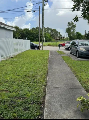 a view of a park with swings and slides