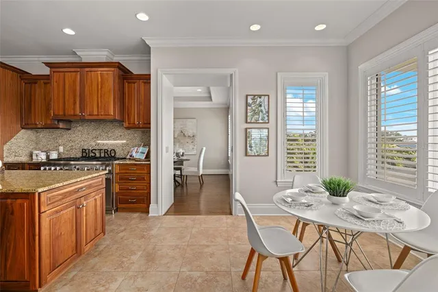 a living room with furniture a flat screen tv and a large window