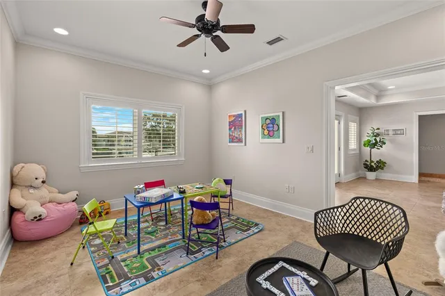 a view of a house with pool and chairs