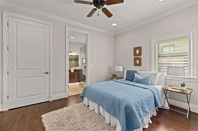 a front view of a house with swimming pool table and chairs