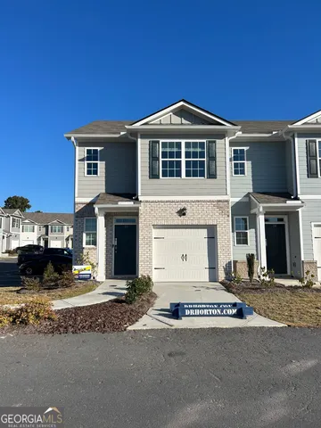 a view of a house with a street
