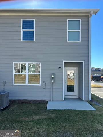 a view of an house with backyard space and garden