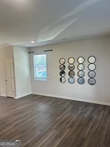 a view of an entryway with wooden floor