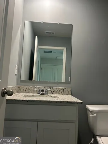 a bathroom with a sink and a toilet