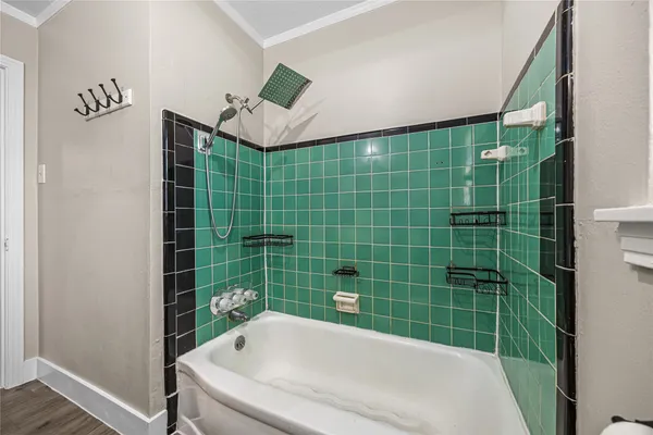 a bathroom with a bath tub and shower