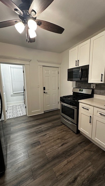 3062 South Lyman Street, Unit 2 Chicago, IL 60608 - Photo 2 of 7 a kitchen with granite countertop a stove cabinets and wooden floor