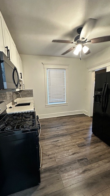 3062 South Lyman Street, Unit 2 Chicago, IL 60608 - Photo 3 of 7 a kitchen with stainless steel appliances granite countertop a stove and a refrigerator
