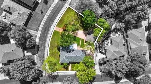 an aerial view of a house with a garden