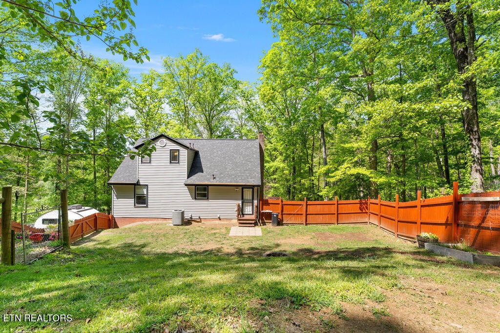8908 Ellis Lane Powell, TN 37849 - Photo 3 of 37 a view of a house with backyard and sitting area
