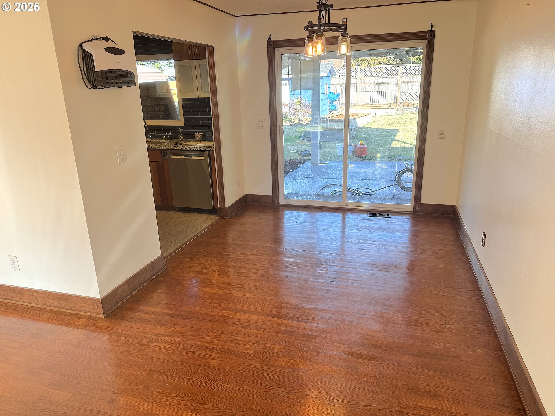 2442 Southeast 190th Avenue Portland, OR 97233 - Photo 14 of 36 an empty room with wooden floor and windows