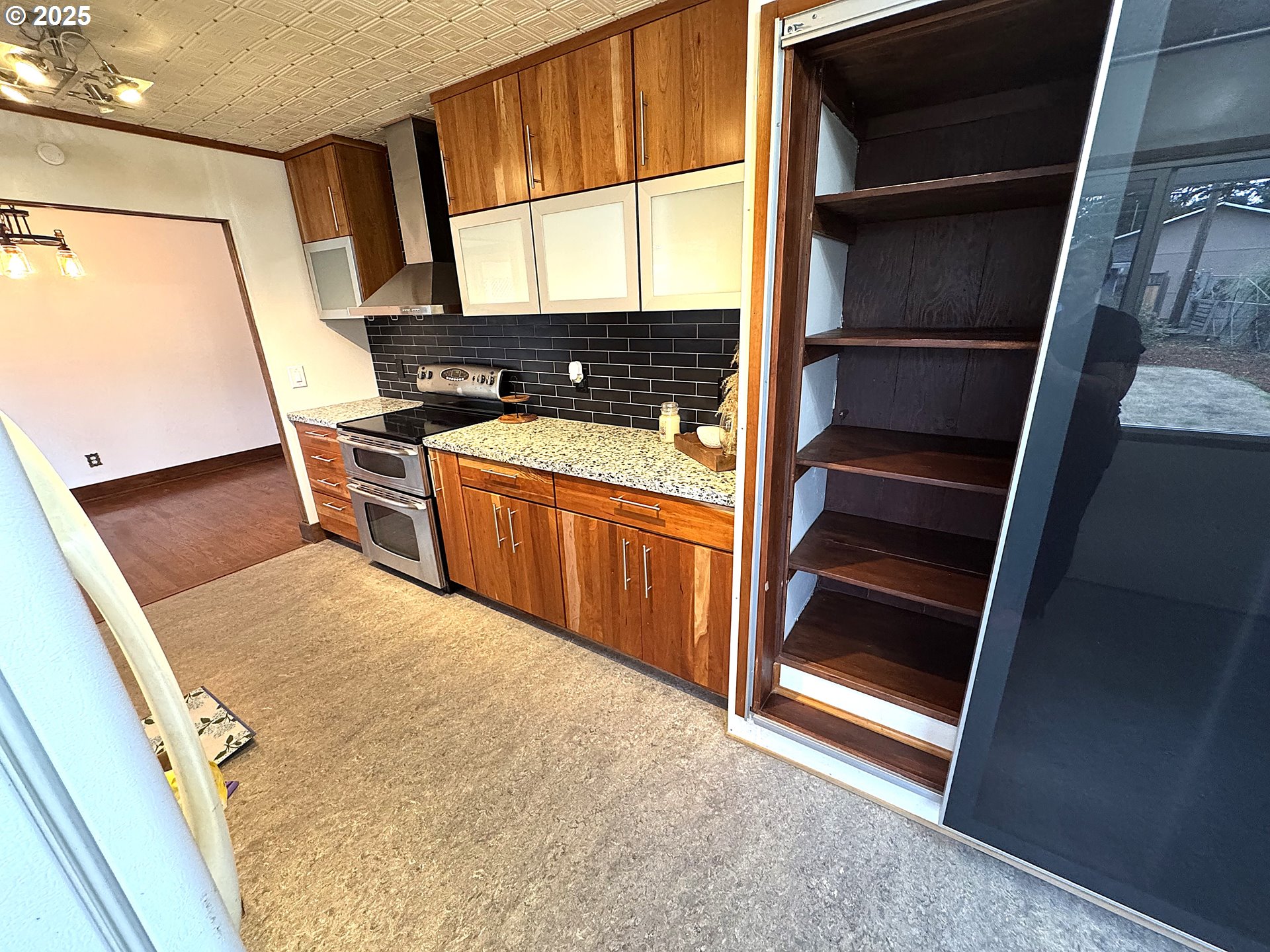 2442 Southeast 190th Avenue Portland, OR 97233 - Photo 10 of 36 a view of washer and dryer with wooden floor