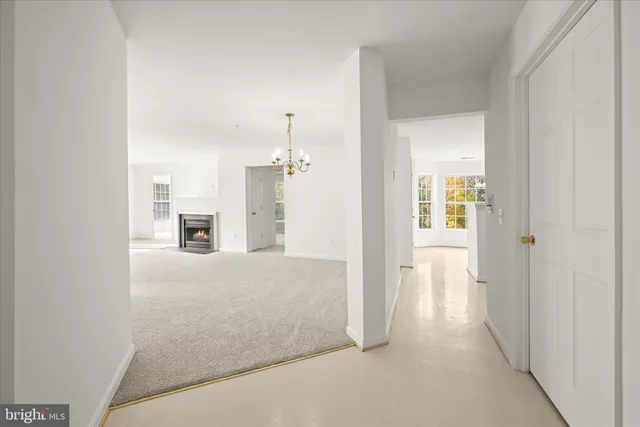 a view of empty room with a fireplace