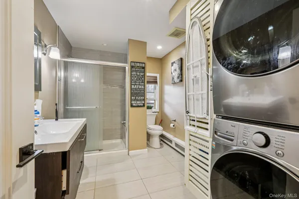 a view of a hallway with washer and dryer