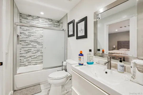 a bathroom with a sink toilet and shower