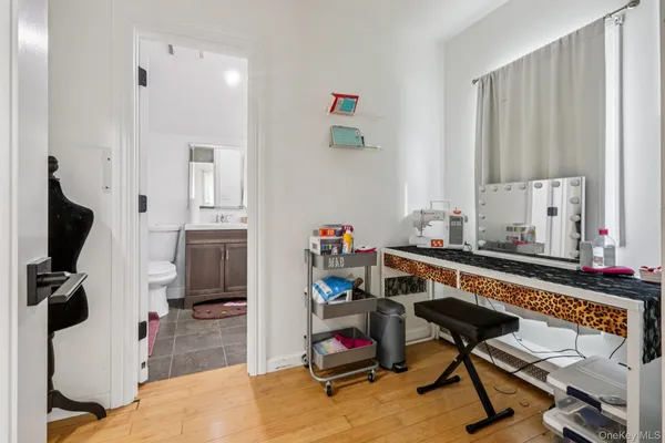 a view of a workspace with furniture and a bedroom