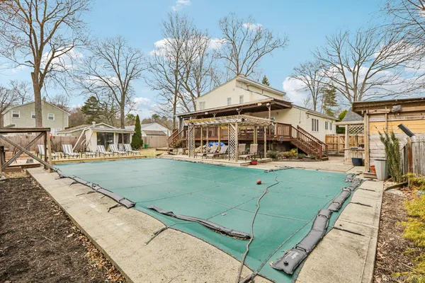a view of a house with large trees