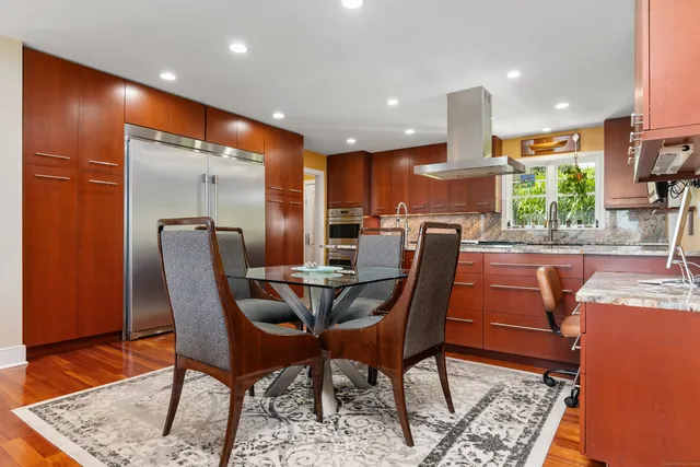 a view of a dining room with furniture window and wooden floor