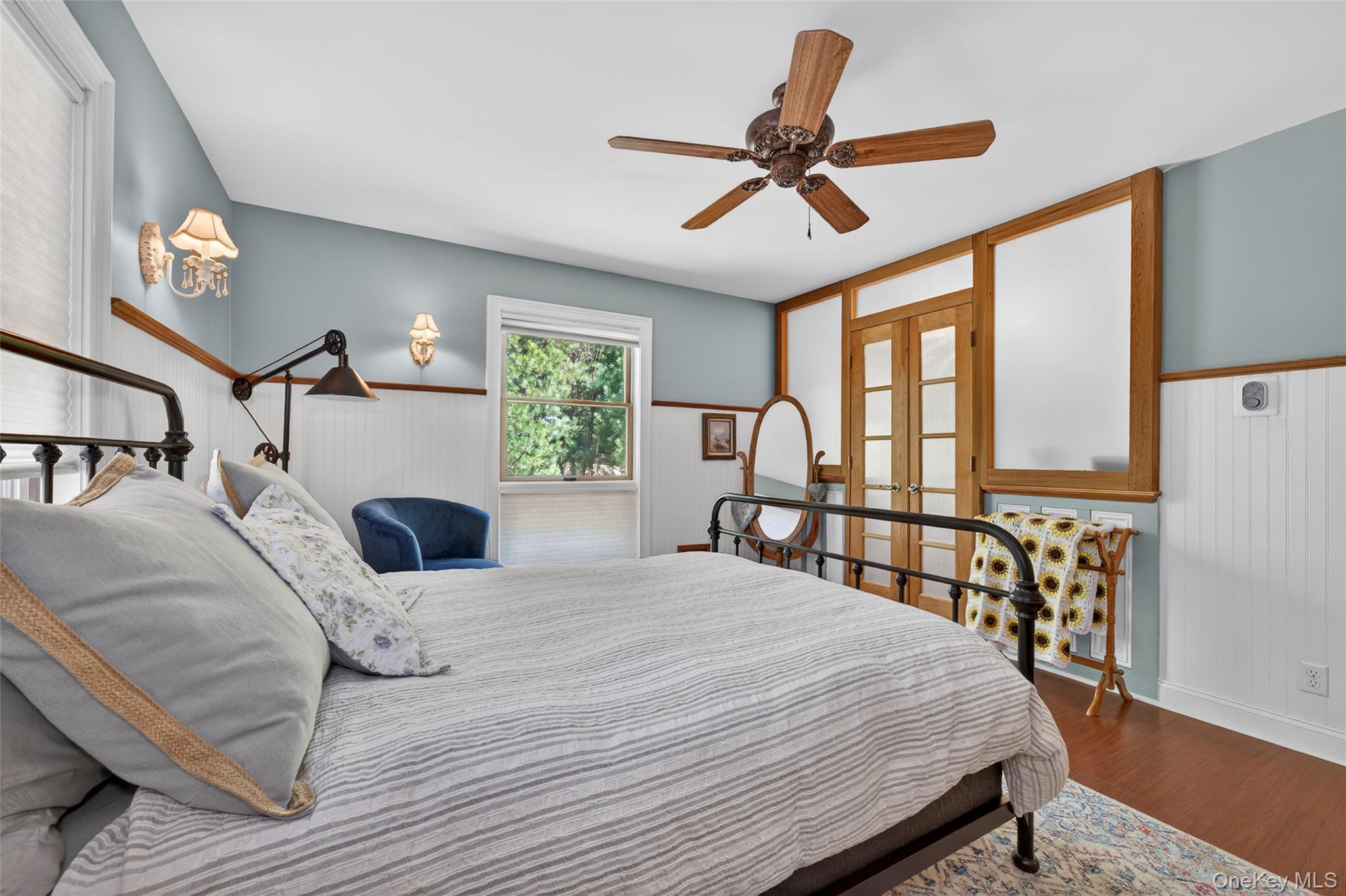 465 Schalck Road Narrowsburg, NY 12764 - Photo 16 of 31 Interior space featuring wood-finish flooring, wainscoting, and a ceiling fan