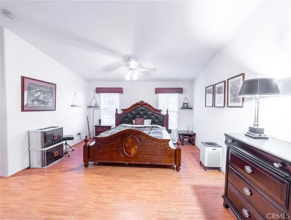 a living room with furniture and a dresser