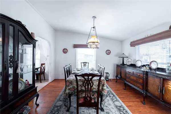 a dining room with furniture and window