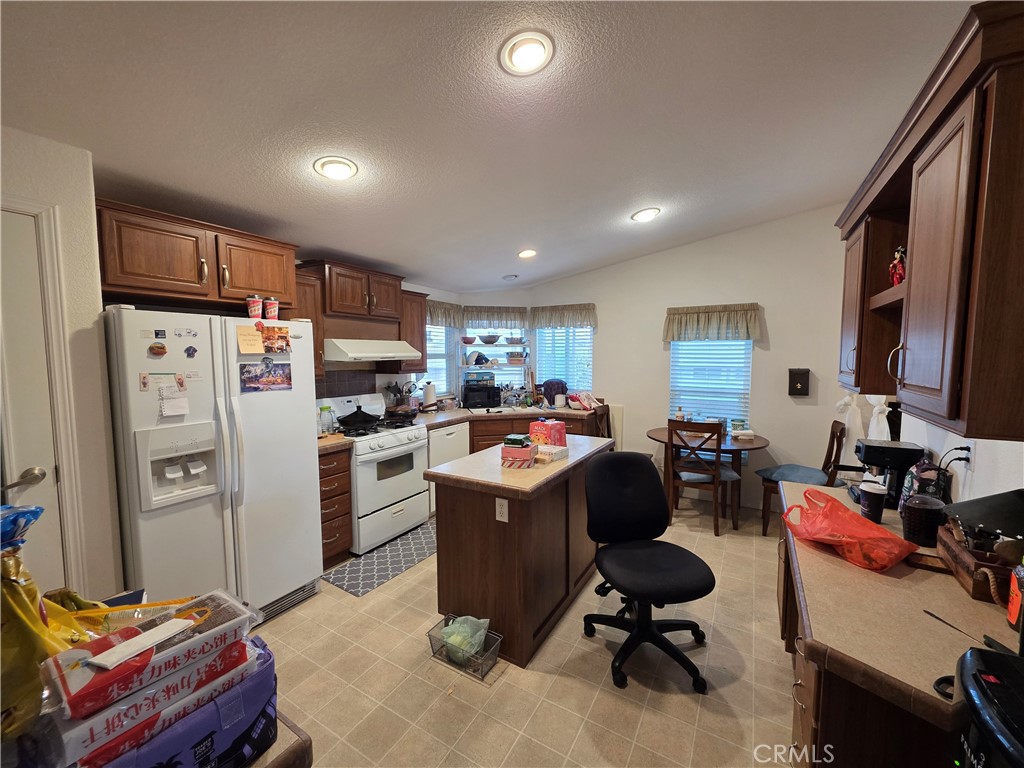 4800 Daleview Avenue, Unit 121 El Monte, CA 91731 - Photo 7 of 10 a view of a workspace with furniture and a window