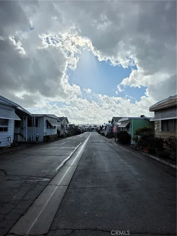 a view of a patio with a table and chairs