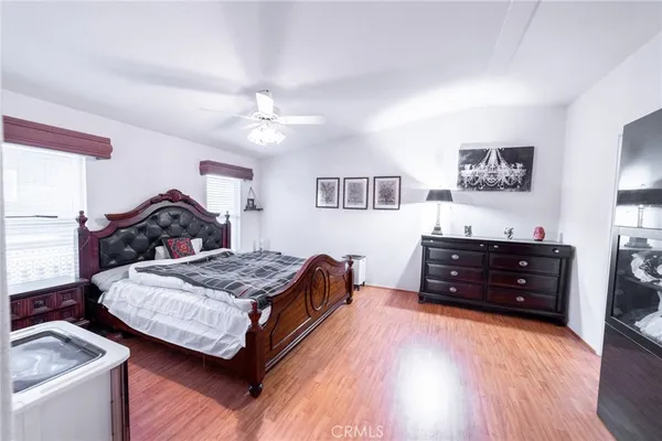 a bedroom with a bed and a dresser