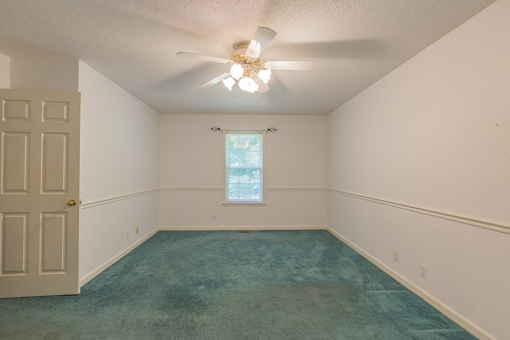 311 Johnson Road Chatsworth, GA 30705 - Photo 38 of 46 wooden floor in an empty room with a window