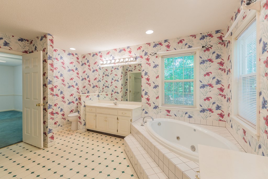 311 Johnson Road Chatsworth, GA 30705 - Photo 42 of 46 a bathroom with a bathtub sink and toilet