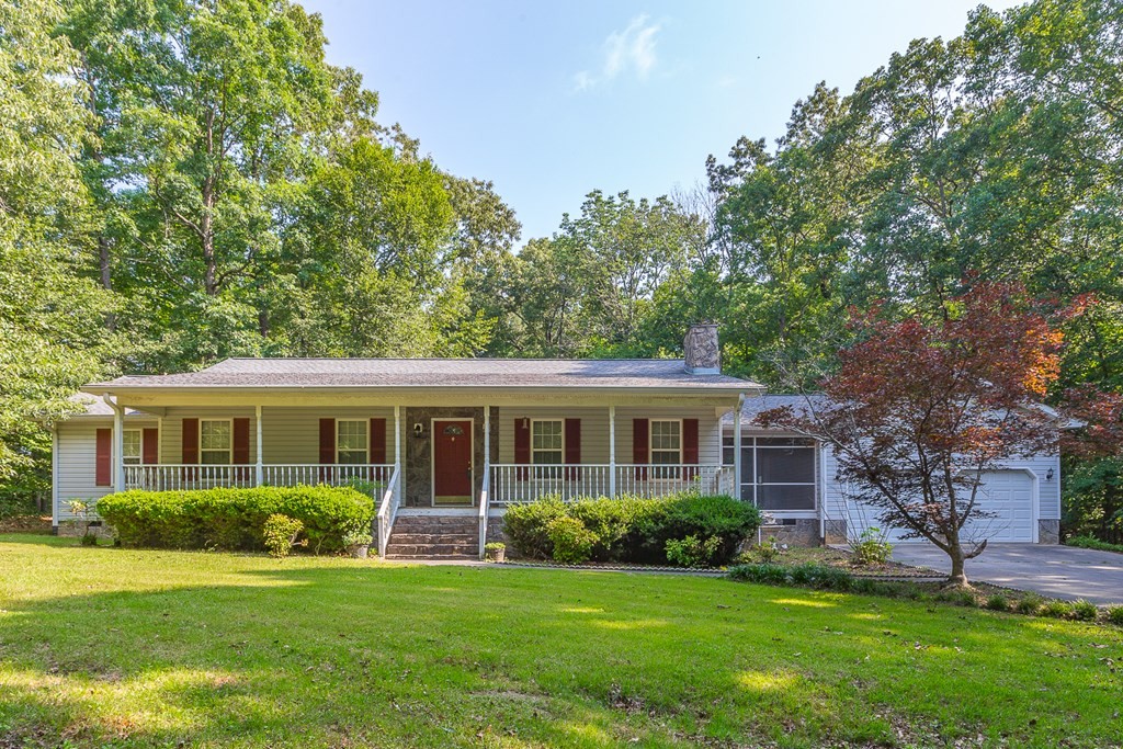 311 Johnson Road Chatsworth, GA 30705 - Photo 5 of 46 a view of a house that has a garden