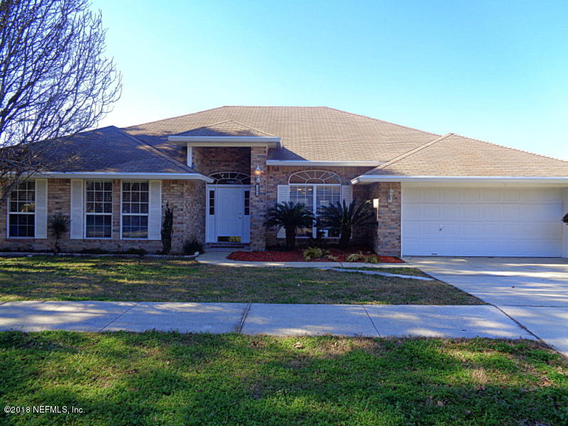 2444 Mallory Hills Road Jacksonville, FL 32221 - Photo 3 of 40 a front view of a house with a yard