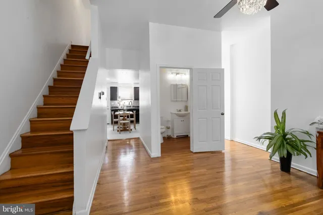 a view of an entryway with wooden floor