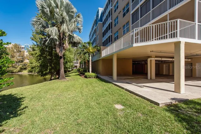 a front view of a building with a garden