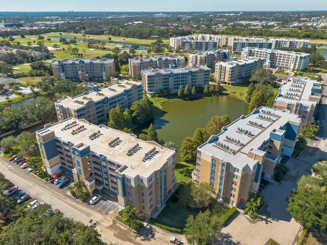 an aerial view of a house with a lake view