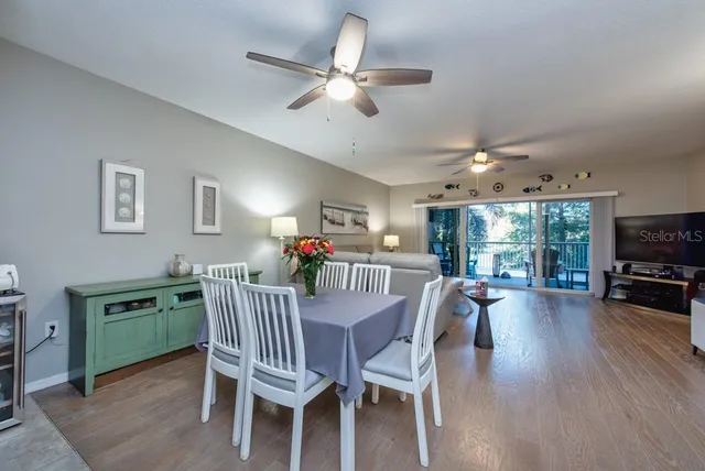 a view of a dining room with furniture window and wooden floor