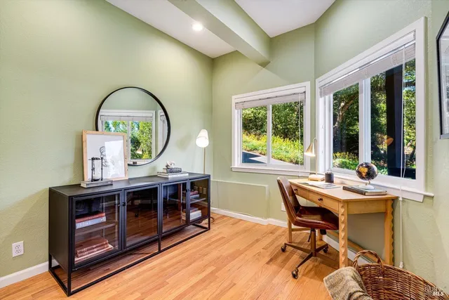 a bedroom with a bed and a table