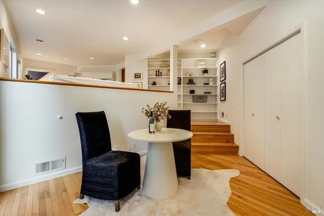 a bed room with two beds and a large window