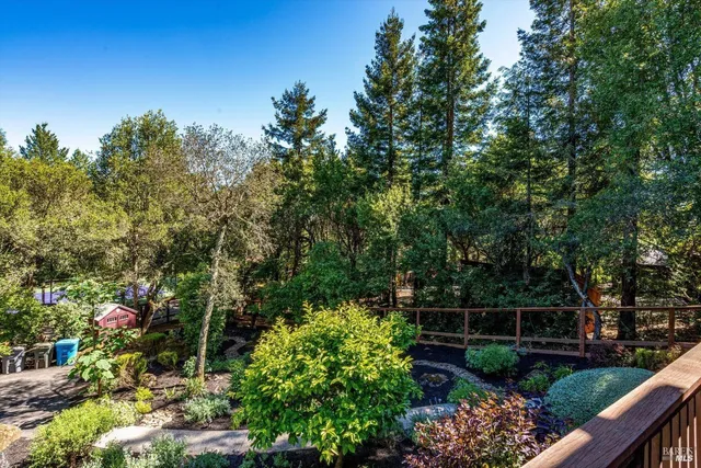 a view of a house with wooden door and deck