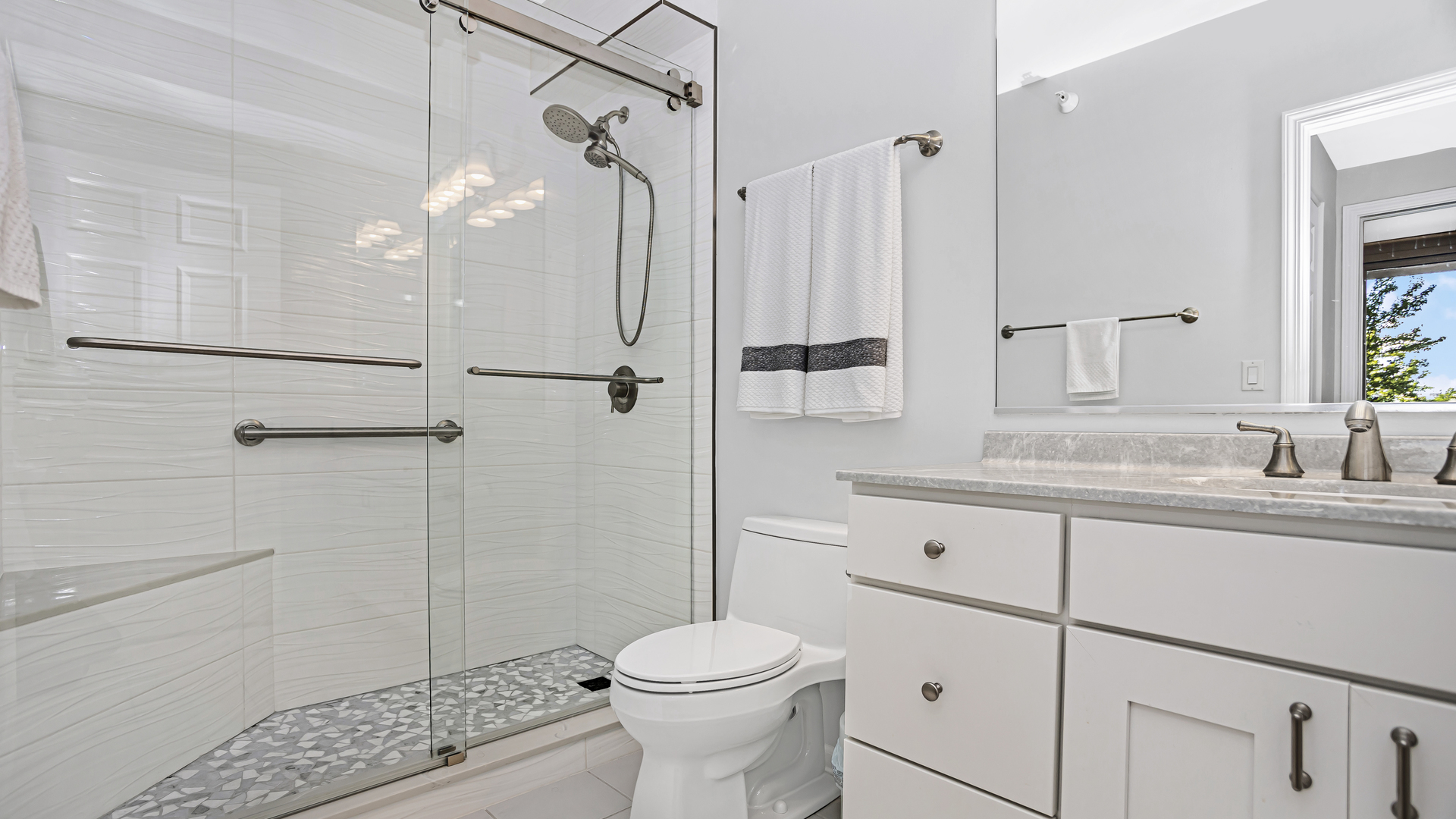 807 Davis Street, Unit 808 Evanston, IL 60201 - Photo 11 of 14 a bathroom with a sink toilet and shower