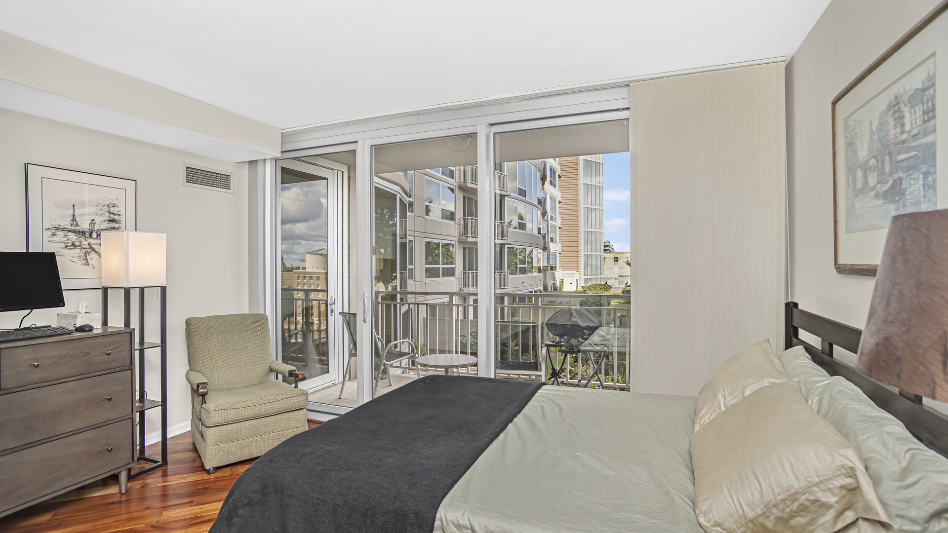 807 Davis Street, Unit 808 Evanston, IL 60201 - Photo 9 of 14 a bedroom with furniture and large window