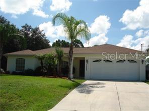 3092 Oklahoma Street North Port, FL 34286 - Photo 1 of 13 a view of a house with a yard and potted plants