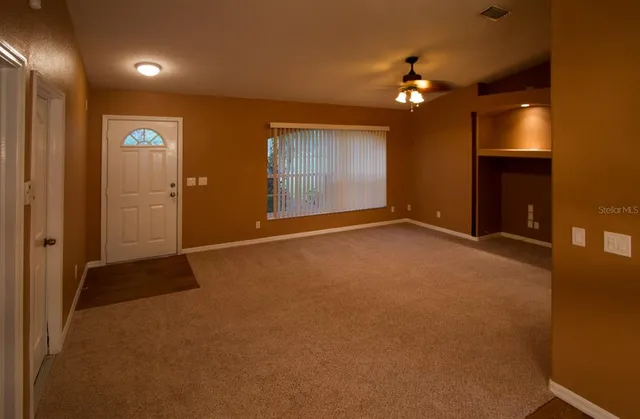 a view of an empty room with a bathroom