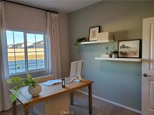 a workspace with furniture and window