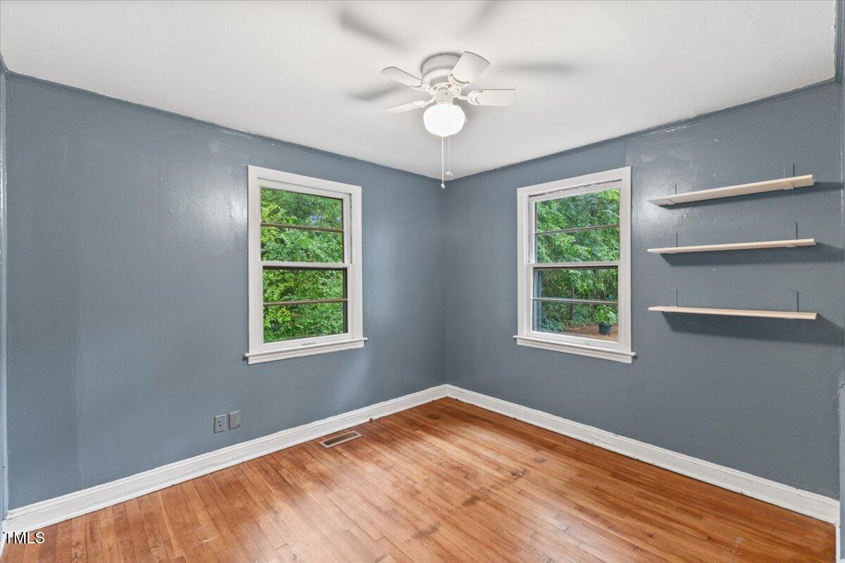2324 Stevens Road Raleigh, NC 27610 - Photo 14 of 50 a view of empty room with window and ceiling fan