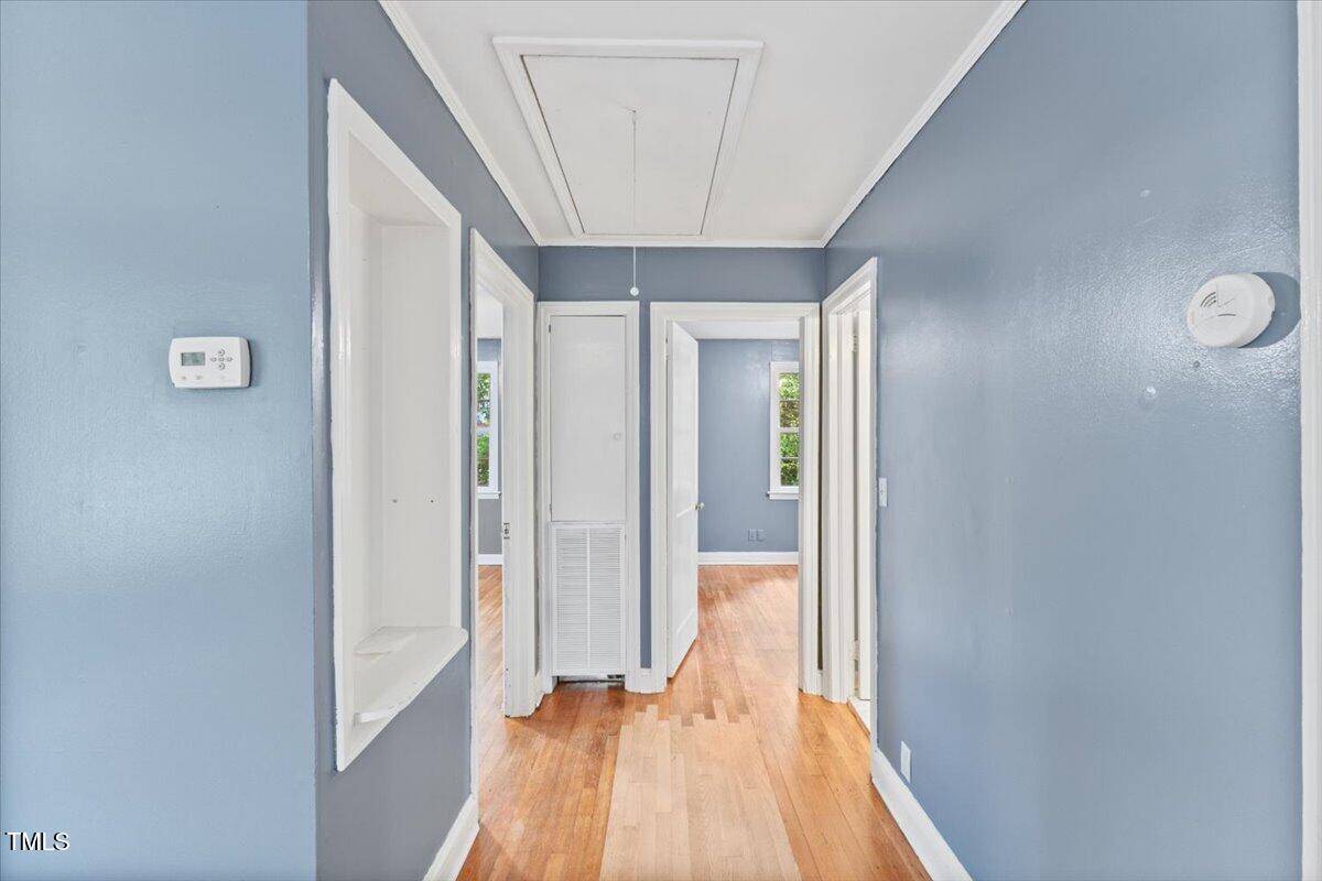 2324 Stevens Road Raleigh, NC 27610 - Photo 20 of 50 a view of hallway with a large window and wooden floor